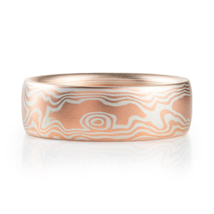 mokume gane wedding band in a woodgrain pattern, red gold and silver