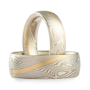 Mokume Gane unisex rings or wedding band set, made by Arn Krebs, twist pattern, metals used are palladium and silver, each with a gold stratum layer (stripe running across the rings following the pattern)