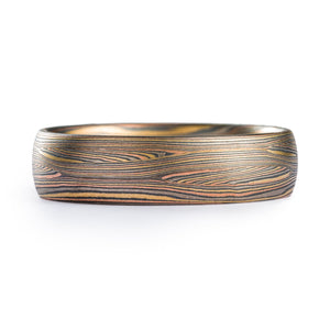 fine lines in this contemporary ring with Tri golds and silver. flowing lines. Todd reed quality. high end. fine jewelry and fine art ring with signature pattern