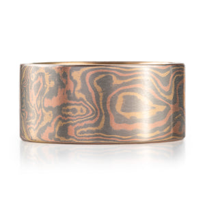 extra wide mokume gane band with a flat profile in woodgrain pattern and all gold palette