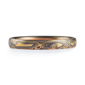 narrow mokume gane ring with red and yellow gold and palladium and oxidized silver