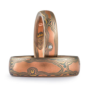mokume woodgrain ring with red gold and diamonds flush set