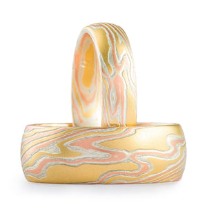 shining gold mokume gane ring set matching twist pattern with 18kt gold