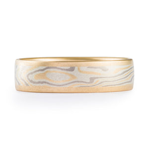 Yellow gold edged mokume gane wedding band, twist pattern with silver and palladium in a smooth finish