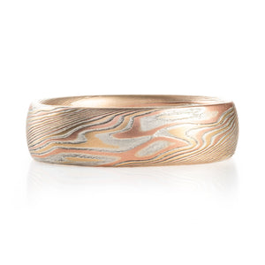 mokume gane ring in twist pattern and warm light metals