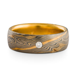 Mokume Gane ring or wedding ring by arn krebs, twist pattern and smoke palette, etched and oxidized finish, added yellow gold stratum and liner, flush set white diamond, white gold palladium and sterling silver