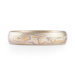 mokume gane wedding ring with yellow gold palladium and silver in a woodgrain style pattern