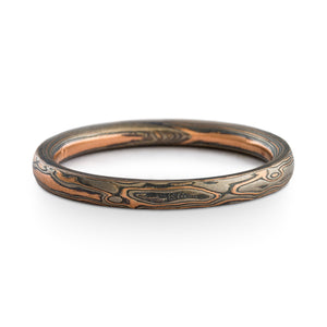 Mokume Gane ring or wedding band by arn krebs, woodgrain pattern and embers palette, thin, red gold palladium and silver