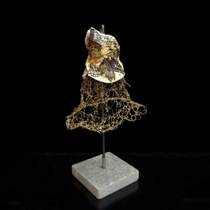 Small scale gold thin wire woven dress gold and black butterfly wings attached to bust on a steel rod marble stand, home decor