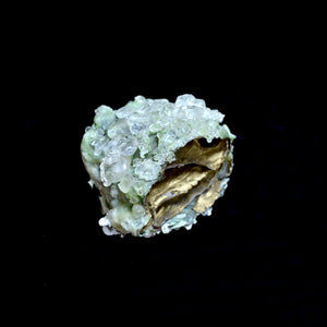 Crystallized geode like item object gold foil lined inside with clear glass clusters on outside, conceptual art, home decor