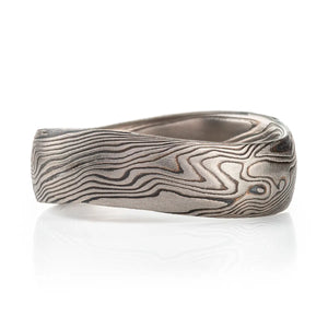 unique mokume gane undulating band made with palladium and oxidized silver