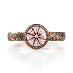diamond mokume gane ring, with patterned bezel to match band, pink stone with red gold yellow gold and oxidized silver