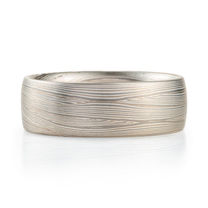 layered metal that looks like fabric or waves, undulating, lines. contemporary modern elegant sleek ring