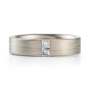 modern contemporary silver and palladium white metal with a square diamonds set in the flowing lines of metal 