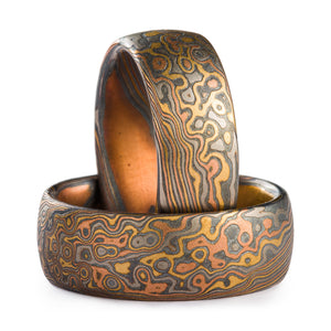 droplet style pattern on set of two mokume gane rings in firestorm palette