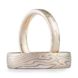 Mokume gane ring set made by arn krebs, yellow gold palladium and silver metal combination in a twist pattern