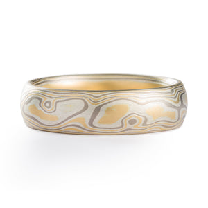 Mokume gane ring made by arn krebs, patterning is made up of alternating layers of silver and palladium, the pattern resembles the grain of a piece of wood