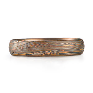 mokume gane narrow band in red gold yellow gold palladium and oxidized silver palette, very linear and detailed pattern