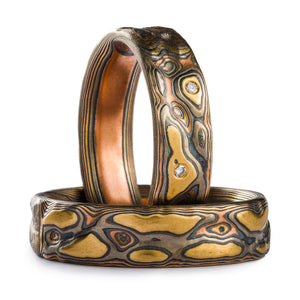 Mokume Gane ring set, Guri Bori patterning that resembles a topographic map, created by carving into the surface of the ring. The metals in the ring are yellow gold, red gold, palladium and silver