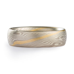 mokume gane band in twist pattern and silver and palladium with an added yellow gold stratum layer