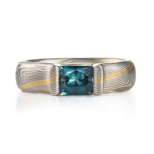 mokume ring with sapphire custom set in bloom style settting. modern heirloom