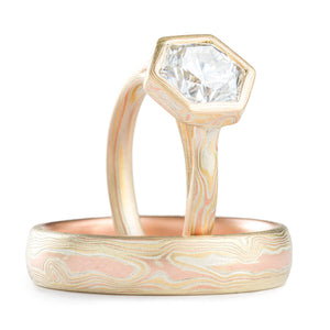 set of mokume gane rings one with hexagon moissanite in a mokume patterned bezel