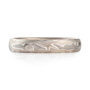mokume gane textured band in woodgrain pattern