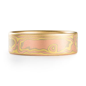 This stunning Mokume Gane band is shown in the woodgrain pattern and our Blaze palette with a satin finish. Blaze features 18kt yellow gold, and 14kt red and white gold.