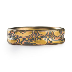 yellow gold rich high islands surrounded by red gold and oxidized silver ring with swirling patterns 