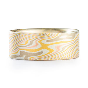 This wide but elegant Mokume Gane band is shown in the Twist Pattern and the Firestorm Metal Combination, with a satin finish and flat profile. Our "Firestorm" palette features 14k Red Gold, 14k Yellow Gold, Palladium, and Sterling Silver.