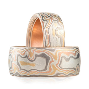 wide mokume gane set made in combination of red gold yellow gold palladium and silver in a woodgrain pattern
