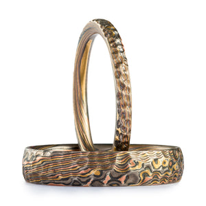 Set of mokume gane rings, twist pattern, with carved surface detailing to imitate hammered metal