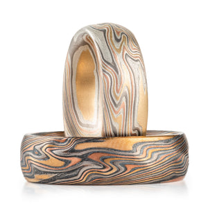 matching mokume gane bands, both made in twist pattern, red gold yellow gold palladium and silver, one ring has oxidized silver for a darker look