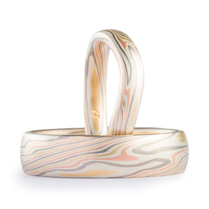 matching ring set, thinner ring has been contoured, could fit with an engagement ring