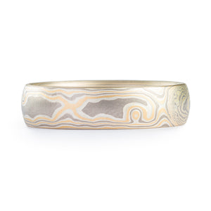 woodgrain patterned mokume gane style band, made with yellow gold palladium and sterling silver