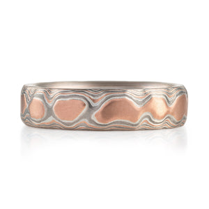 red gold islands that are rimmed with silver metal and then grey metal. layers of metal in islands
