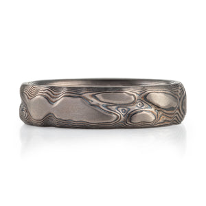 grey and black tones of metal with islands and currents of water. silver and palladium metal 