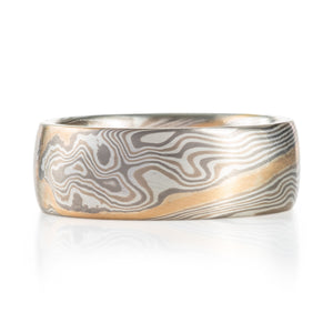 mokume gane wedding band silver white gold and palladium ring with a yellow gold stratum layer