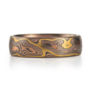 mokume gane arn krebs band featuring a yellow gold accent stratum paired with woodgrain patternign