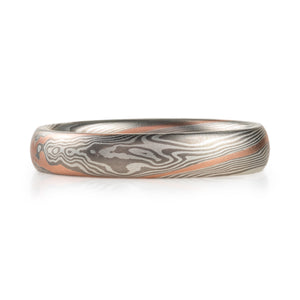 mokume gane elegant band in twist pattern with palladium and silver and an added red gold stratum layer for contrast