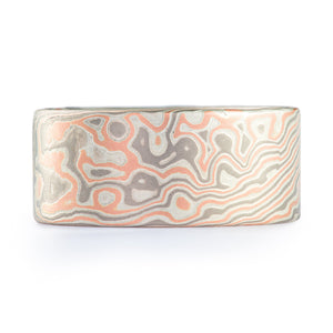 wide flat profile mokume gane ring in graphic twist droplet pattern, red gold palladium and silver combination