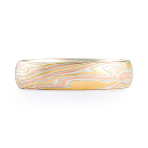 mokume gane band in 18kt yellow gold red gold and silver with a heavily etched finish