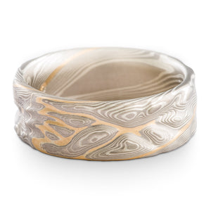 Mokume gane guri bori pattern ring, custom made by arn krebs, with a twist and yellow gold stratum layer
