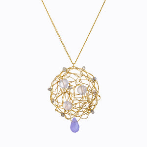 Iolite gemstone pendant, stones are interwoven with gold filled wire spun into a flat disk, also a larger iolite drop hanging from the very bottom center of the pendant
