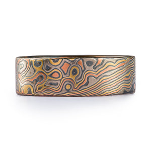 rustic feeling mokume gane ring with flat profile in twist droplet arn krebs pattern