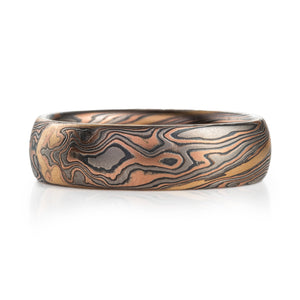 Arn Krebs mokume gane ring in twist pattern with red gold palladium oxidized silver, and an added yellow gold stratum layer