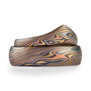 Mokume gane ring set, one shaped into an interesting pointed contour to fit with an engagement ring, firestorm palette ,twist pattern