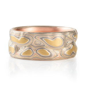 mokume gane ring, carved to create topographic texture, metals used are yellow gold red gold palladium and sterling silver