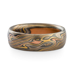 Mokume Gane ring or wedding band by Arn Krebs, twist pattern and firestorm palette (red gold yellow gold palladium and silver), the ring also has our Kazaru surface treatment, the surface is gently and subtly carved into to create gentle texture that complements the twisting mokume pattern