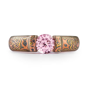 mokume gane beautiful tension set stone with a light pink sapphire